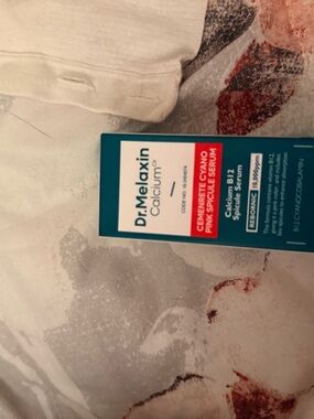 Dr. Melaxin Calcium Pink Spot Serum - Teal & White Packaging